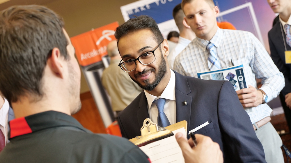 Mechanical engineering student Safwan Hanif talks to a representative from Honda 