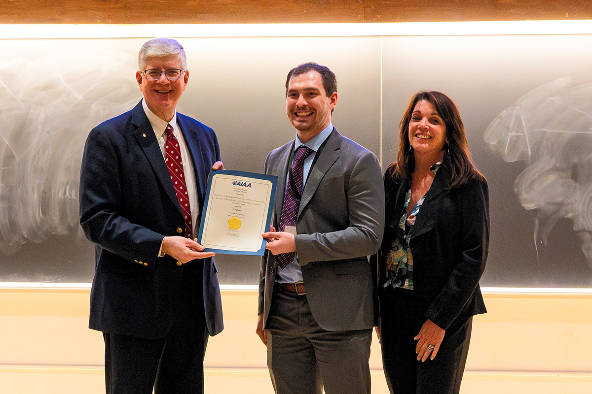 UA student Jason Mack receives his third-place certificate with Christopher Pestak (HX-5, LLC) and Merrie Scott (AIAA).