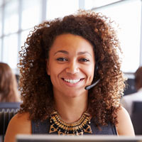 A financial aid expert helping a student with a question about loans over the phone