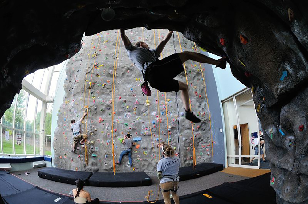 Climbers on rock wall